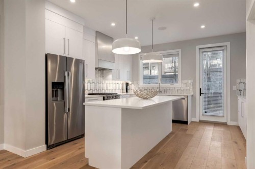 40 Timberline Way Sw, Calgary, AB - Indoor Photo Showing Kitchen With Stainless Steel Kitchen With Upgraded Kitchen