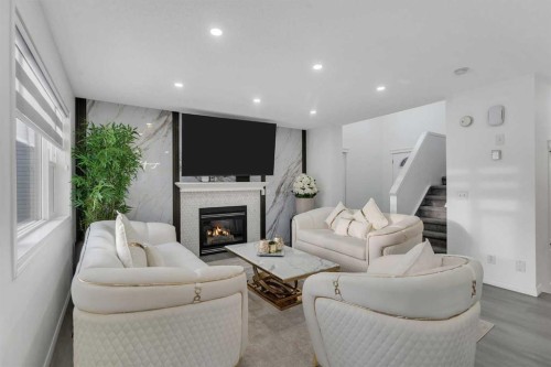41 Royal Birch Terrace Nw, Calgary, AB - Indoor Photo Showing Living Room With Fireplace