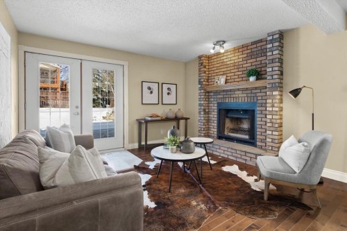 56 Hawkcliff Way Nw, Calgary, AB - Indoor Photo Showing Living Room With Fireplace