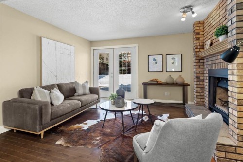 56 Hawkcliff Way Nw, Calgary, AB - Indoor Photo Showing Living Room With Fireplace