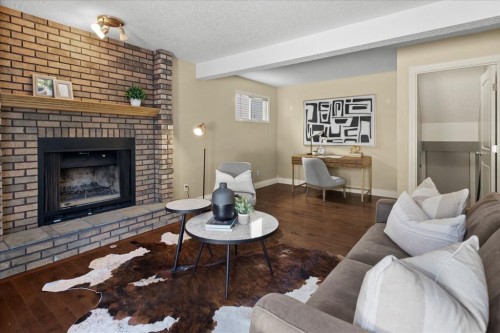56 Hawkcliff Way Nw, Calgary, AB - Indoor Photo Showing Living Room With Fireplace