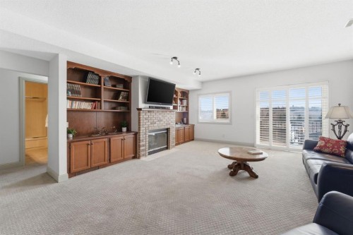 54 Edgeland Close Nw, Calgary, AB - Indoor Photo Showing Living Room With Fireplace