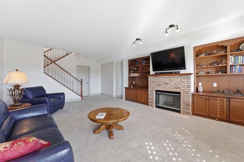 54 Edgeland Close Nw, Calgary, AB - Indoor Photo Showing Living Room With Fireplace