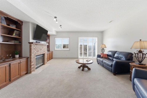 54 Edgeland Close Nw, Calgary, AB - Indoor Photo Showing Living Room With Fireplace