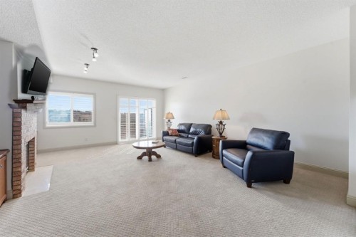 54 Edgeland Close Nw, Calgary, AB - Indoor With Fireplace