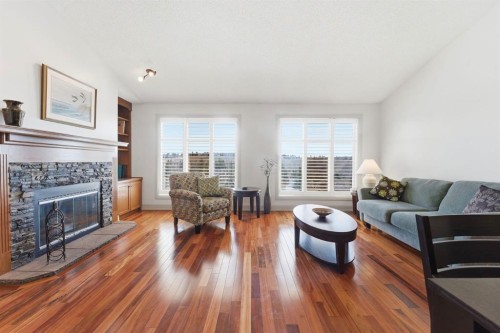 54 Edgeland Close Nw, Calgary, AB - Indoor Photo Showing Living Room With Fireplace