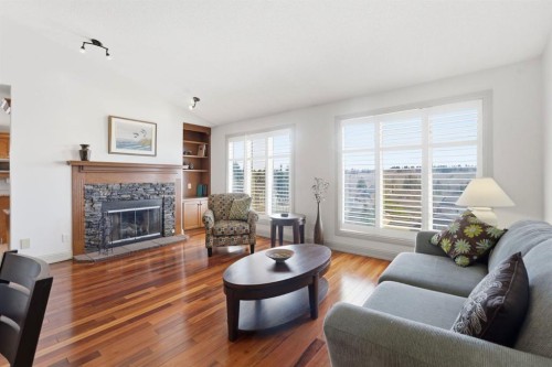 54 Edgeland Close Nw, Calgary, AB - Indoor Photo Showing Living Room With Fireplace