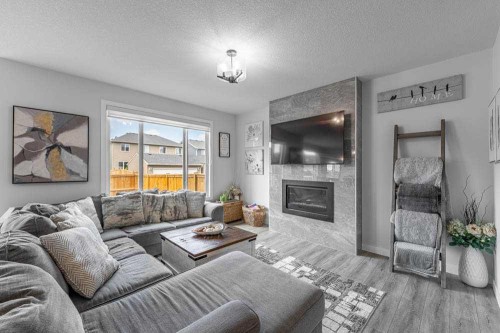 178 Creekstone Path Sw, Calgary, AB - Indoor Photo Showing Living Room With Fireplace