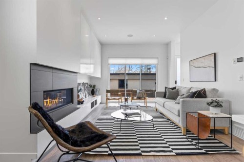 1400 26A Street Sw, Calgary, AB - Indoor Photo Showing Living Room With Fireplace