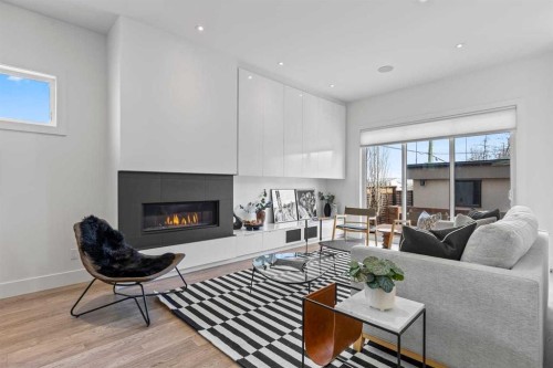 1400 26A Street Sw, Calgary, AB - Indoor Photo Showing Living Room With Fireplace