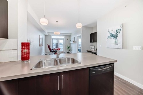 405-2300 Evanston Square, Calgary, AB - Indoor Photo Showing Kitchen With Double Sink