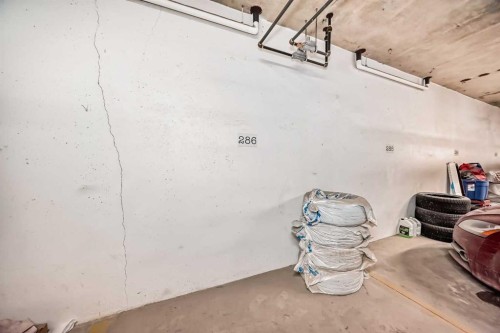 405-2300 Evanston Square, Calgary, AB - Indoor Photo Showing Garage