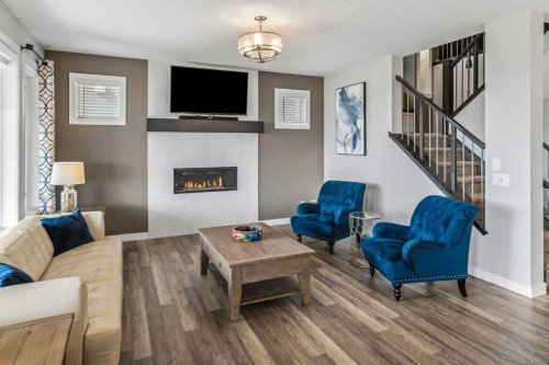 209 Sandpiper Crescent, Chestermere, AB - Indoor Photo Showing Living Room With Fireplace