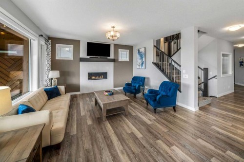209 Sandpiper Crescent, Chestermere, AB - Indoor Photo Showing Living Room With Fireplace