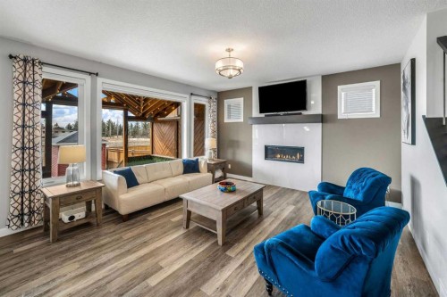 209 Sandpiper Crescent, Chestermere, AB - Indoor Photo Showing Living Room With Fireplace
