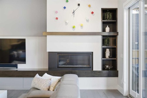10 Lissington Drive Sw, Calgary, AB - Indoor Photo Showing Living Room With Fireplace