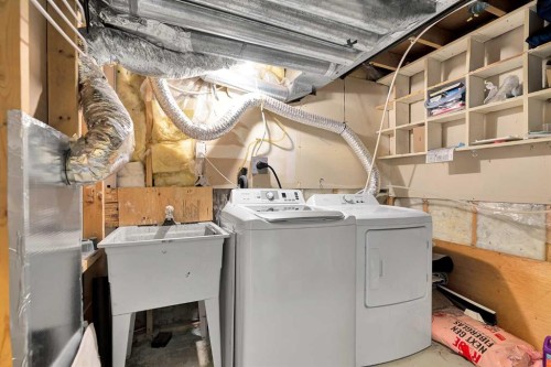 44 Strathclair Rise Sw, Calgary, AB - Indoor Photo Showing Laundry Room
