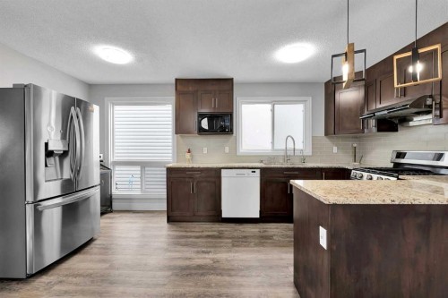 44 Strathclair Rise Sw, Calgary, AB - Indoor Photo Showing Kitchen With Stainless Steel Kitchen With Upgraded Kitchen