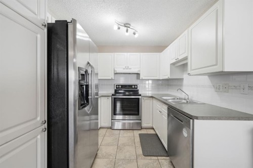 94 Mt Aberdeen Manor Se, Calgary, AB - Indoor Photo Showing Kitchen With Stainless Steel Kitchen With Double Sink