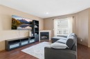 94 Mt Aberdeen Manor Se, Calgary, AB  - Indoor Photo Showing Living Room With Fireplace 