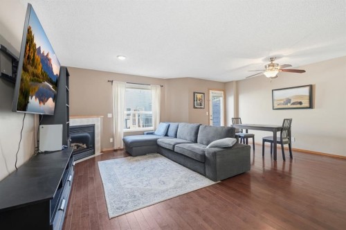 94 Mt Aberdeen Manor Se, Calgary, AB - Indoor Photo Showing Living Room With Fireplace