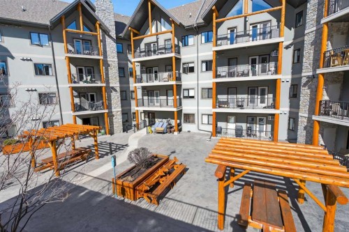 203-77 George Fox Trail, Cochrane, AB - Outdoor With Balcony With Facade