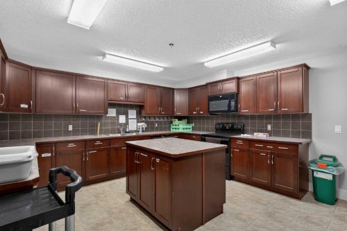 203-77 George Fox Trail, Cochrane, AB - Indoor Photo Showing Kitchen