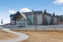 203-77 George Fox Trail, Cochrane, AB  - Outdoor With Balcony With Facade 