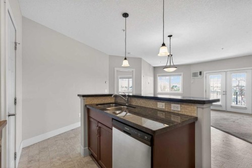 203-77 George Fox Trail, Cochrane, AB - Indoor Photo Showing Kitchen With Double Sink