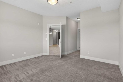 203-77 George Fox Trail, Cochrane, AB - Indoor Photo Showing Other Room