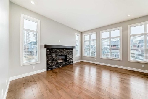 7904 Masters Boulevard Se, Calgary, AB - Indoor Photo Showing Living Room With Fireplace