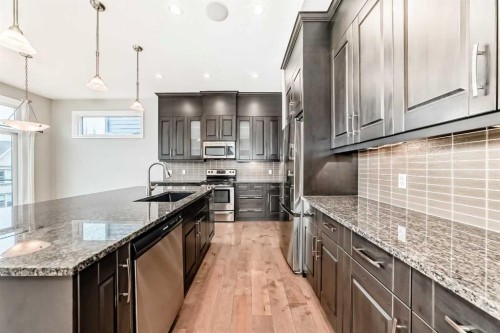 7904 Masters Boulevard Se, Calgary, AB - Indoor Photo Showing Kitchen With Upgraded Kitchen