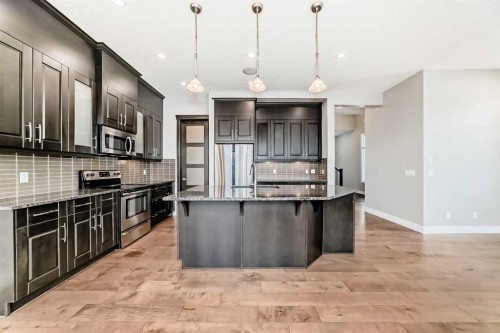 7904 Masters Boulevard Se, Calgary, AB - Indoor Photo Showing Kitchen With Upgraded Kitchen