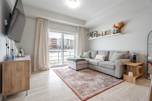 112-20 Seton Park Se, Calgary, AB - Indoor Photo Showing Living Room