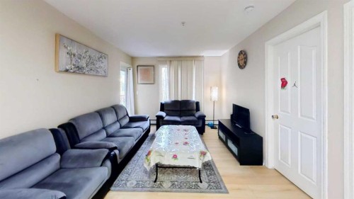 222-355 Taralake Way Ne, Calgary, AB - Indoor Photo Showing Living Room