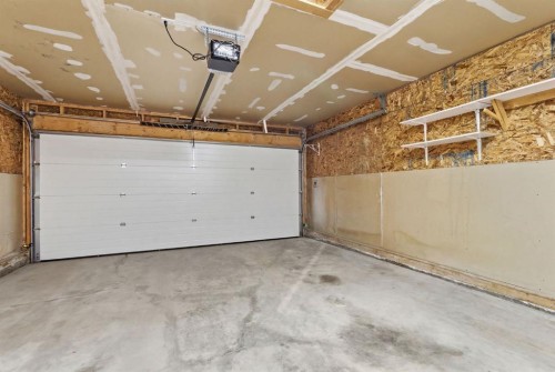 59 Silver Springs Way Nw, Airdrie, AB - Indoor Photo Showing Garage