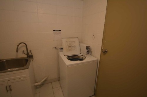 Calgary, AB - Indoor Photo Showing Laundry Room