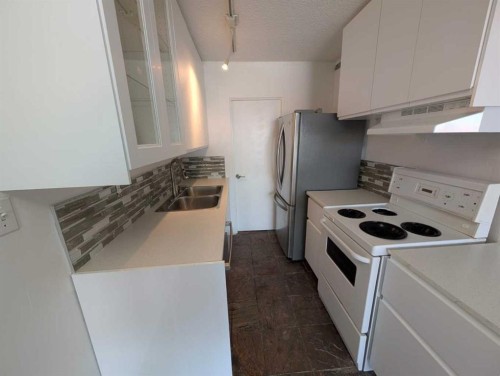 Calgary, AB - Indoor Photo Showing Kitchen With Double Sink