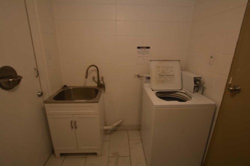 Calgary, AB - Indoor Photo Showing Laundry Room