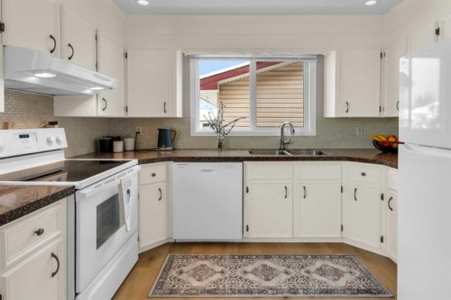 4640 Rundlehill Road Ne, Calgary, AB - Indoor Photo Showing Kitchen With Double Sink