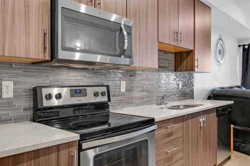 3202-215 Legacy Boulevard Se, Calgary, AB - Indoor Photo Showing Kitchen With Double Sink With Upgraded Kitchen