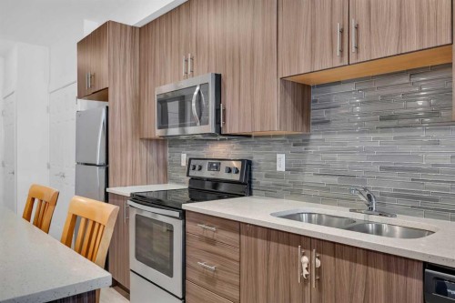 3202-215 Legacy Boulevard Se, Calgary, AB - Indoor Photo Showing Kitchen With Double Sink With Upgraded Kitchen