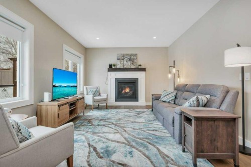 5825 Maple Crescent, Innisfail, AB - Indoor Photo Showing Living Room With Fireplace
