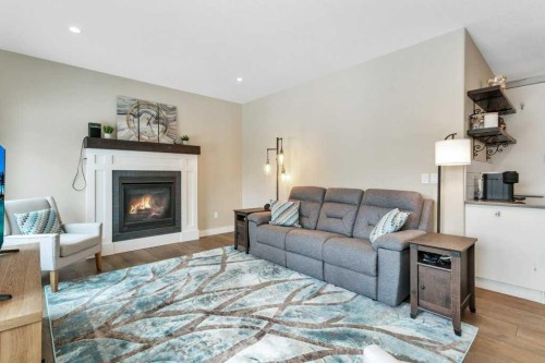5825 Maple Crescent, Innisfail, AB - Indoor Photo Showing Living Room With Fireplace