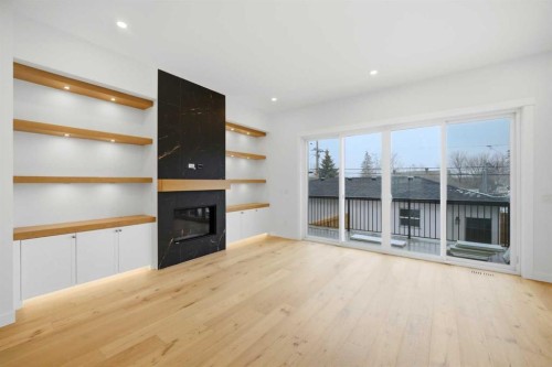 4711 19 Avenue Nw, Calgary, AB - Indoor Photo Showing Other Room With Fireplace