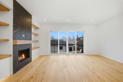 4711 19 Avenue Nw, Calgary, AB - Indoor Photo Showing Living Room With Fireplace
