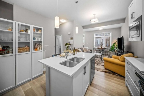 210 Crestbrook Common Sw, Calgary, AB - Indoor Photo Showing Kitchen With Double Sink