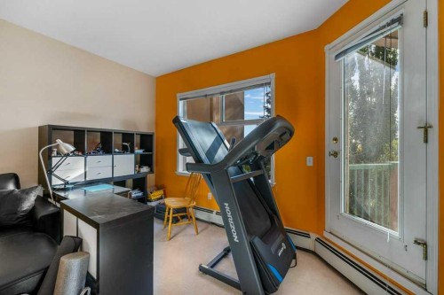 215-200 Lincoln Way Sw, Calgary, AB - Indoor Photo Showing Gym Room