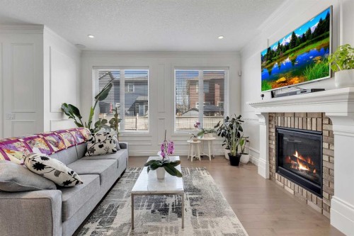393 Evansborough Way Nw, Calgary, AB - Indoor Photo Showing Living Room With Fireplace