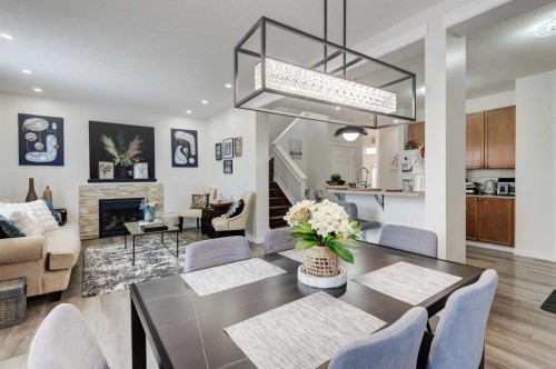 52 Bridlemeadows Common Sw, Calgary, AB - Indoor Photo Showing Other Room With Fireplace